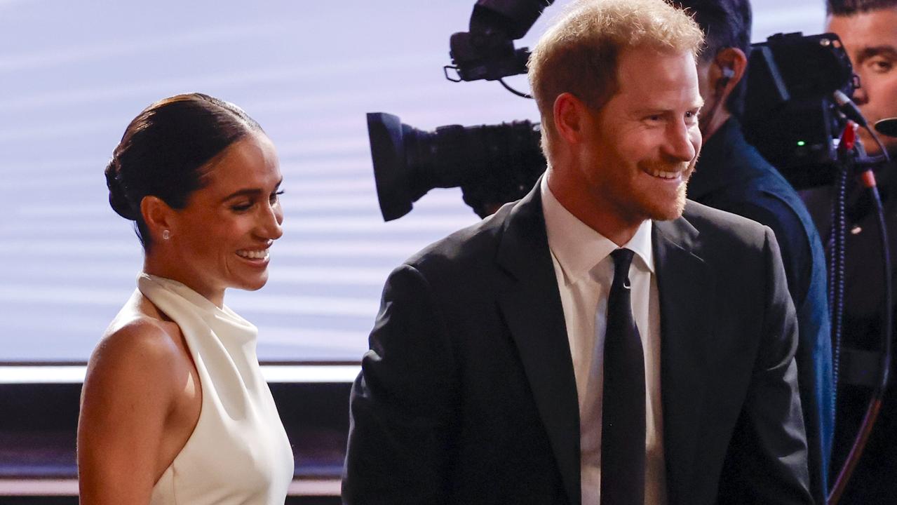 Harry with wife Meghan Markle. Photo by Frazer Harrison/Getty Images