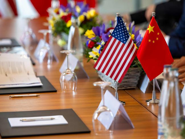 US and Chinese flags prior to meeting to discuss trade relations and tariffs. Picture: AFP