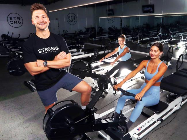 Michael Ramsey, founder of STRONG Pilates, pictured with Leah Johnsen and Michelle Nowland. Picture: Nigel Hallett