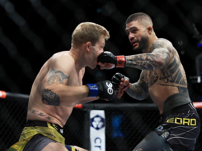 SYDNEY, AUSTRALIA - SEPTEMBER 10: Tyson Pedro of Australia punches Anton Turkalj of Sweden during the UFC 293 event at Qudos Bank Arena on September 10, 2023 in Sydney, Australia. (Photo by Mark Evans/Getty Images)