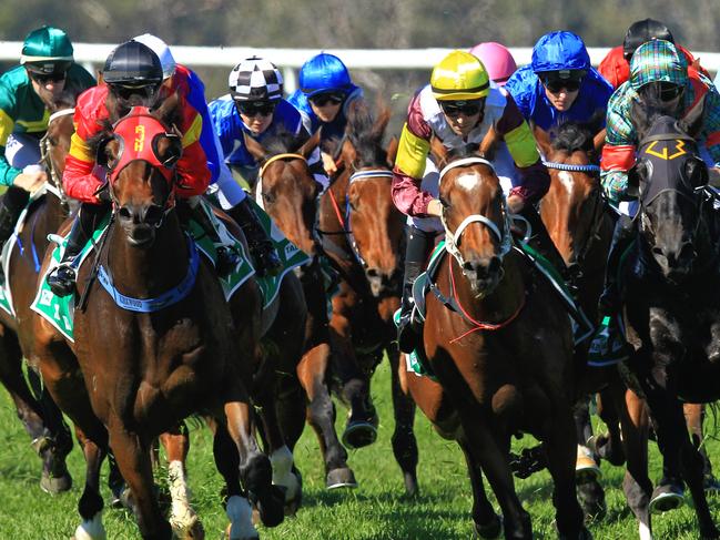 Loving home ridden by Tye Angland  (yellow cap, maroon with yellow armbands) wins race 1 during Scone  Races located in the Upper Hunter Region of NSW. The Bend . Pic Jenny Evans