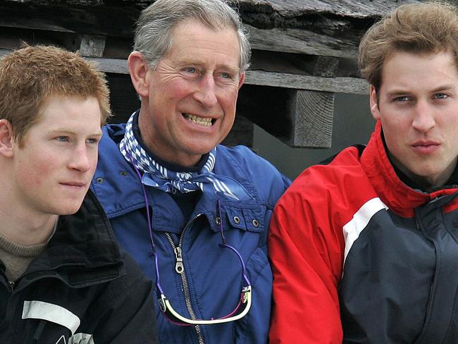 MARCH 31, 2005: Britain's Prince of Wales, Charles (C), with his sons Harry (L) and William (R) during a media photocall, in Monbiel near the Swiss resort of Klosters, 31/03/05, where they are on their annual skiing holiday.Royals / Family Picture: Ap