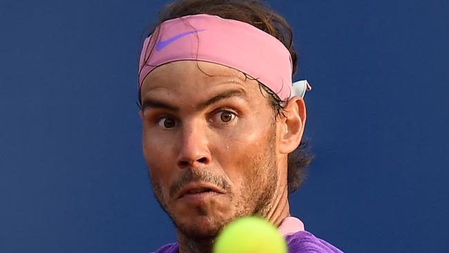 Spain's Rafael Nadal returns the ball to Greece's Stefanos Tsitsipas during the ATP Barcelona Open tennis tournament singles final match at the Real Club de Tennis in Barcelona on April 25, 2021. (Photo by Josep LAGO / AFP)