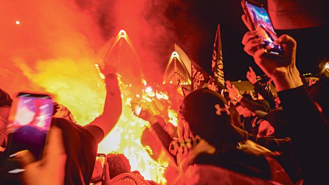 A flag-burning mob at the Sydney Opera House celebrates the October 7 attack by Hamas last year. Picture: NCA NewsWire/Jeremy Piper