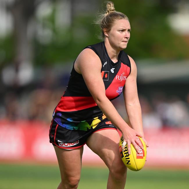 MELBOURNE, AUSTRALIA - OCTOBER 20: Daria Bannister of the Bombers about to kick during the round eight AFLW match between Essendon Bombers and North Melbourne Kangaroos at Windy Hill, on October 20, 2024, in Melbourne, Australia. (Photo by Vince Caligiuri/Getty Images)