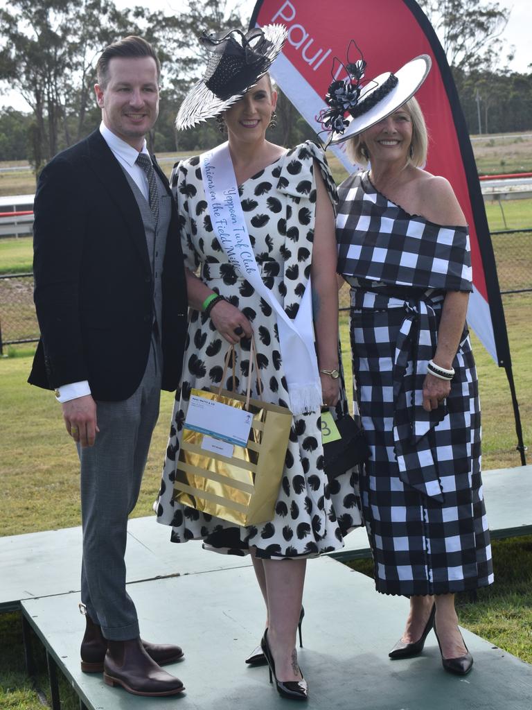 Kathleen Henderson (centre), the winner of the millinery section of Fashions of the Field, with Debbie Lodwick and John Hopkins at the Yeppoon Turf Club's Derby Day races at Keppel Park Racecourse on November 2, 2024.