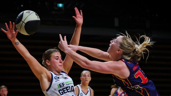 Adelaide’s Haylee Andrews and Geelong’s Elissa Brett get physical on Sunday in the Round 16 clash. Picture: Sarah Reed/Getty Images.