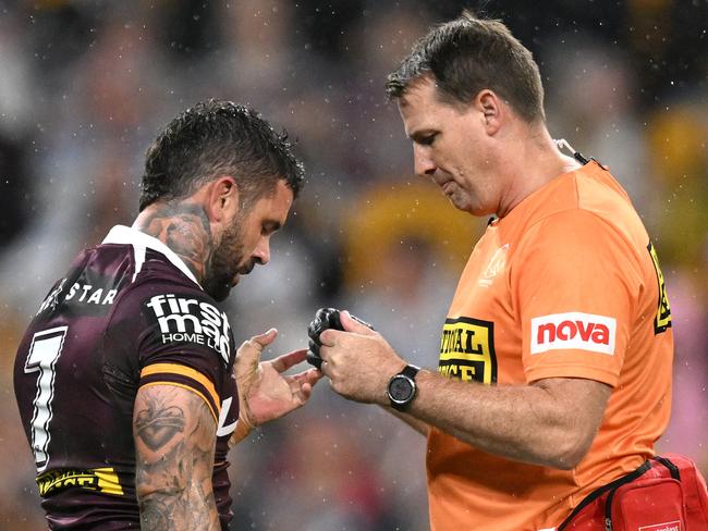 Adam Reynolds receives treatment on field during match against the Bulldogs.