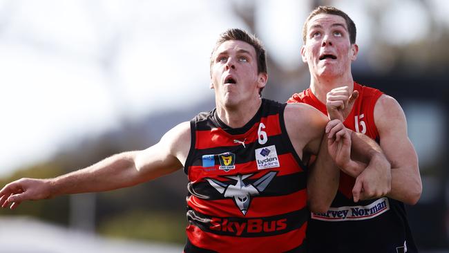 Lauderdale's Haydn Smith battles North Hobart's Hamish Allan in the ruck earlier in the TSL season. Smith dislocated his ankle against Glenorchy on Wednesday night. Picture: Zak Simmonds