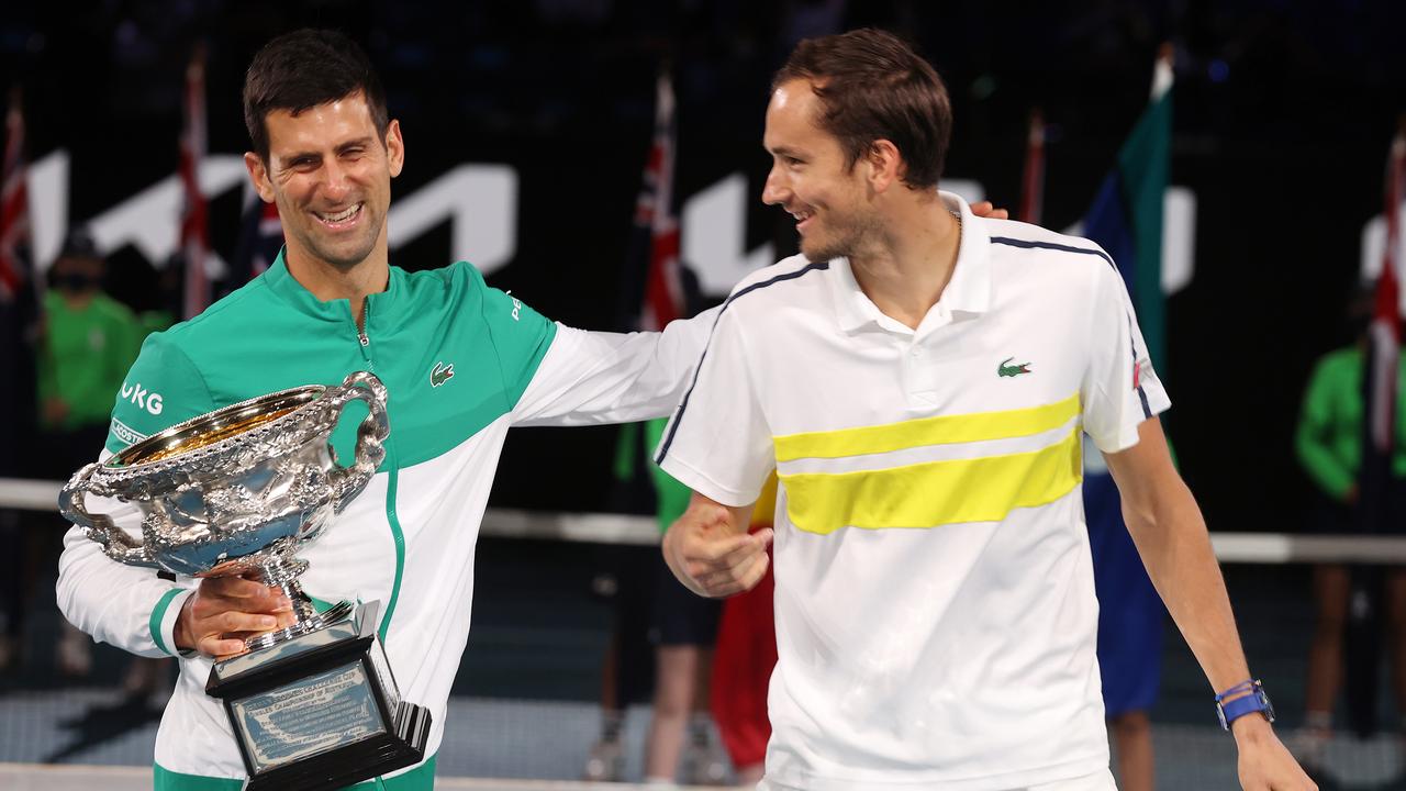 Novak Djokovic shares a laugh with Daniil Medvedev after he defeated the Russian at the 2021 Australian Open.