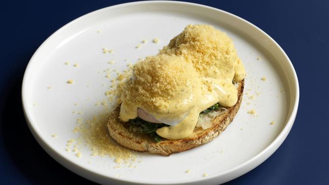 Benedict with poached eggs, cheese kransky, creamed spinachy, sauerkraut and hollandaise. Picture: Jason Loucas