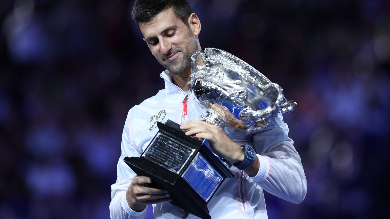 Novak Djokovic's sweetest victory. Photo by Clive Brunskill/Getty Images