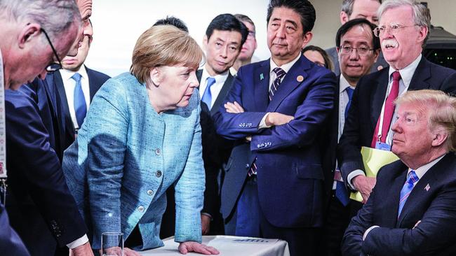 German chancellor Angela Merkel stares down US President Donald Trump at last year’s G7. Picture: Jesco Denzel /Bundesregierung via Getty Images