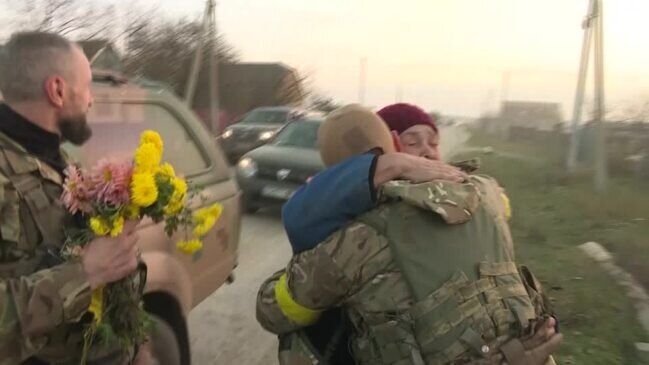 Villagers greet Ukrainian soldiers with flowers