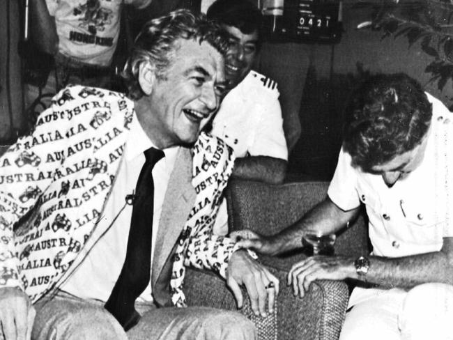 Aust Prime Minister Bob Hawke, wearing an Australia II jacket, shares the moment of victory with flag officers of the Royal Perth Yacht Club at their all night party after Australia II won the America's Cup race in the USA 27 Sep 1983. Pic News Limited. Yachting Australia's First Century Historical