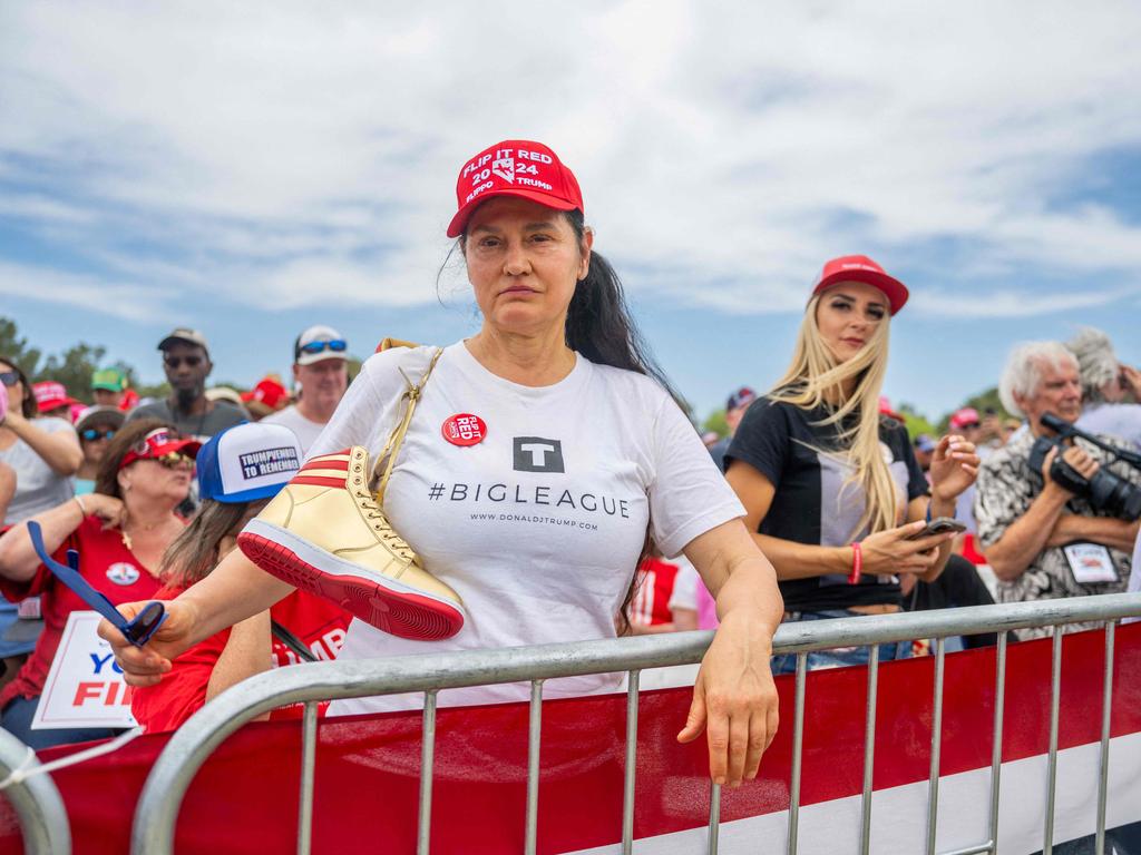 Supporters Donald Trump wait together ahead of a campaign rally. Picture: Getty/AFP