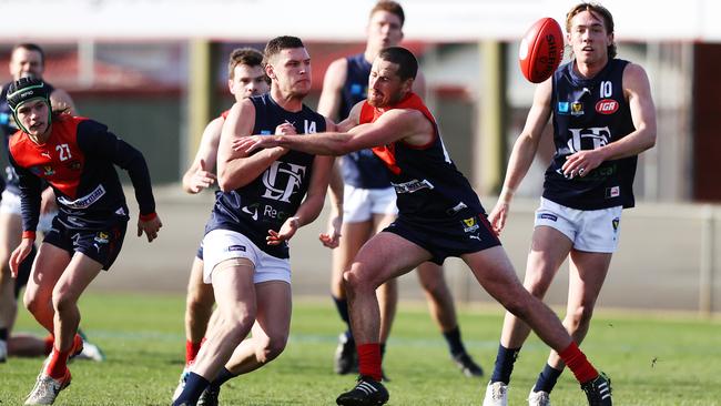 Round 5 TSL match between North Hobart v Launceston from North Hobart Oval. Launceston's Casey Brown and North Hobart's Troy Cunliffe compete for the ball. Picture: Zak Simmonds