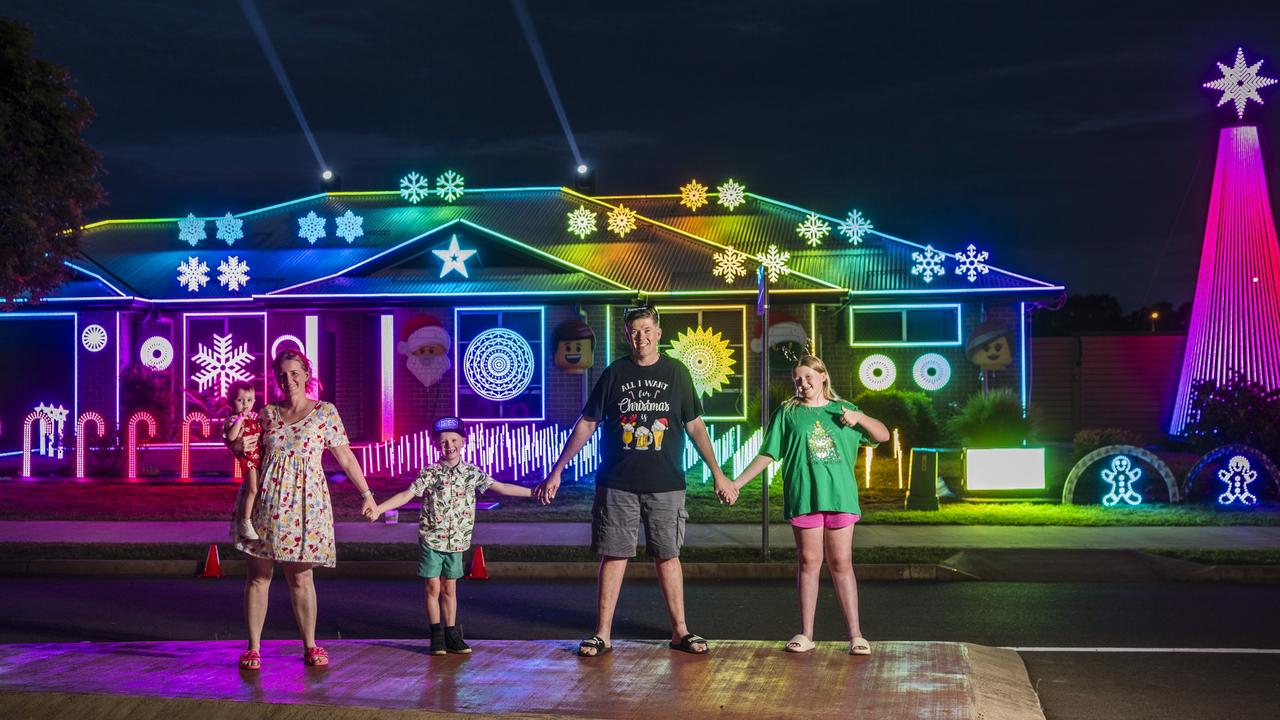 The Kearneys Spring Christmas lights display of the Scarborough family (from left) Nicole Scarborough holding Lily Maskill, Archie Scarborough, John Scarborough and Kaitlyn Scarborough. Picture: Kevin Farmer