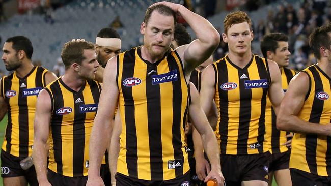 Jarryd Roughead leads the Hawks off the MCG after the loss to the Cats. Picture: Wayne Ludbey