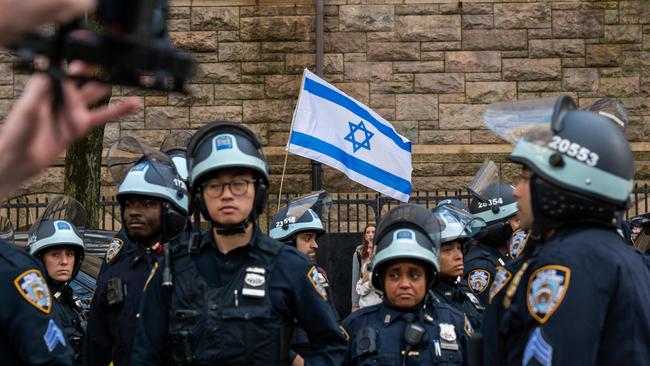 An Israeli flag flies at a pro-Palestinian rally at Fordham University Lincoln Center campus in New York after a group established an encampment inside a building. (Photo: Spencer Platt/Getty Images)