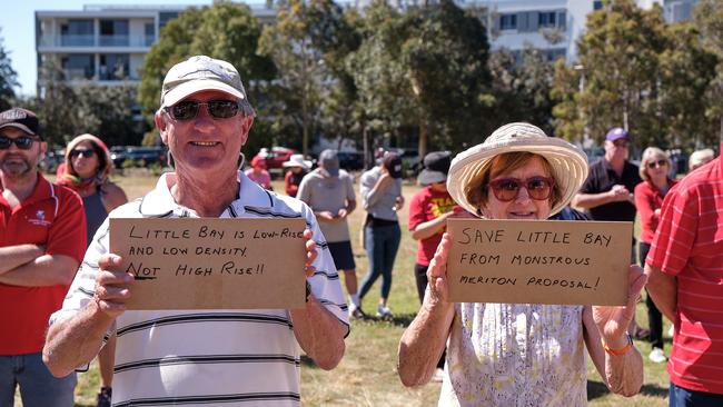 Two protesters with their signs. Picture: Zac Rushton