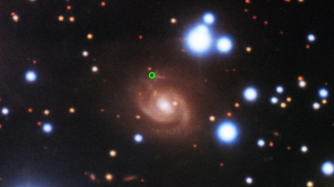 Image of SDSS J015800.28+654253.0, the host galaxy of Fast Radio Burst (FRB). The green circle shows the location of the FRB. Picture: Gemini Observatory/NSF's Optical-Infrared Astronomy Research Laboratory/AURA