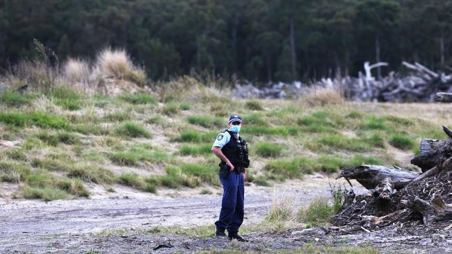 Police at the scene of a burnt out car near Heatherbrae, about 20km away from where the man‘s body was found in Salt Ash. A homicide investigation has been launched after the man was found dead with a head injury. Picture: NCA NewsWire / Peter Lorimer