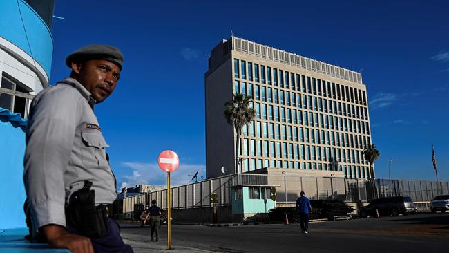 A police officer stands guard across the street from the US embassy in Havana. Picture: AFP.