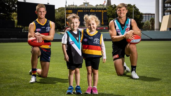 Brodie and Sophie with Adelaide Crows player David Mackay and Port Adelaide footballer Ollie Wines at Adelaide Oval ahead of the 2021 season. Picture James Elsby