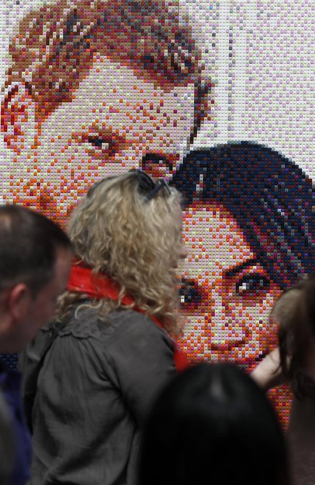 Visitors use Bright Brights to construct a portrait of Britain's Prince Harry and US actress Meghan Markle in Windsor on May 18, 2018, the day before the Royal wedding. Picture: AFP PHOTO / Adrian DENNIS