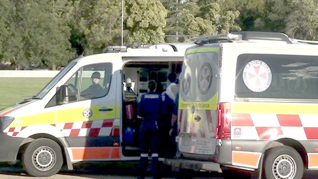 An injured child is transferred into a road ambulance at Molong on way to Orange Hospital. Picture: TNV