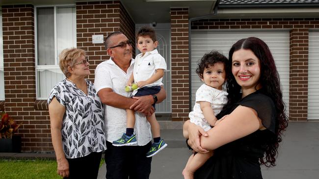 Mary Jekki-Acosta, with children Ezekiel and Jasmine, was helped into the housing market by parents-in-law Francisco Acosta and Maria Elena Montaez. Picture: Toby Zerna