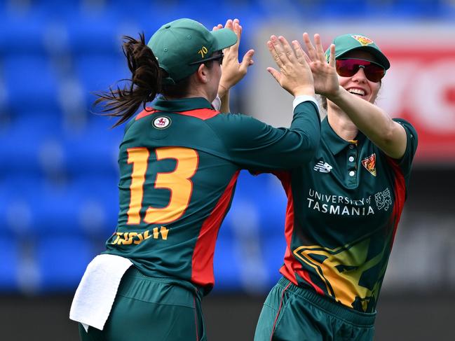 Maisy Gibson and Nicola Carey of the Tigers celebrate the wicket of Rachel Carroll of the Meteors. (Photo by Steve Bell/Getty Images)