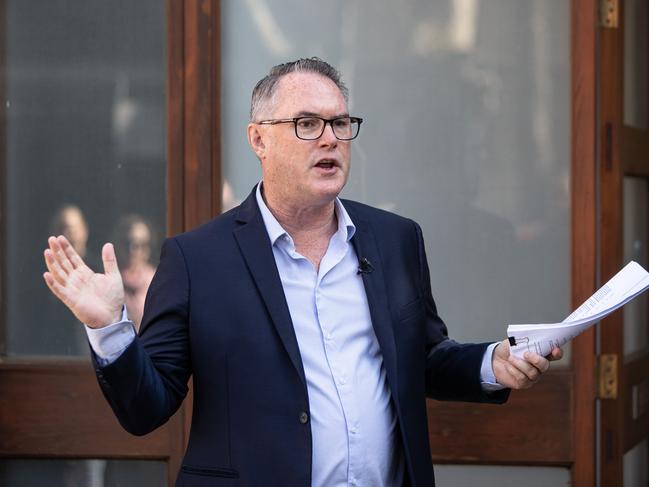 Property guru John McGrath brings down the gavel on a sale in Sydney. Picture: Julian Andrews