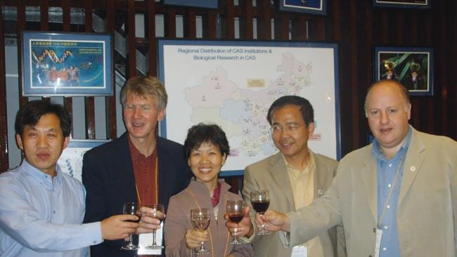 EcoHealth alliance President Peter Daszak (far right) celebrates with the Wuhan Institute of Virology's Shi Zheng-li (centre) and CSIRO's Linga wang (centre-right) circa 2005. Picture: Supplied