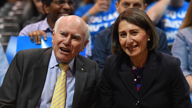 Former prime minister John Howard and NSW Premier Gladys Berejiklian at a campaign rally at Sydney Olympic Park. Picture: AAP 