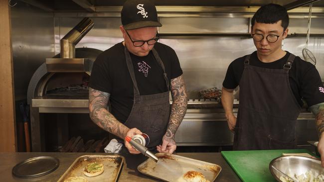 Chef Adam Liston, left, cooks at ShoSho. Picture: Nick Clayton.