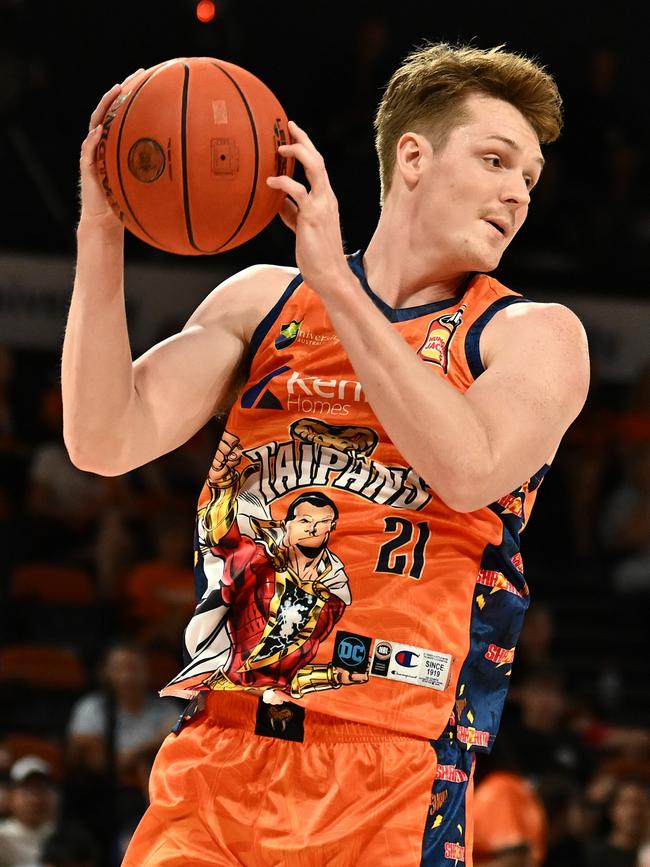 CAIRNS, AUSTRALIA - DECEMBER 07: Sam Waardenburg of the Taipans catches the rebound during the round 10 NBL match between Cairns Taipans and Sydney Kings at Cairns Convention Centre, on December 07, 2023, in Cairns, Australia. (Photo by Emily Barker/Getty Images)