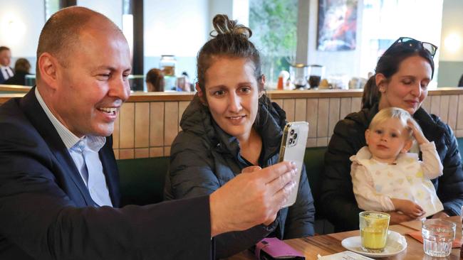 Josh Frydenberg chats with customers at a cafe in his Melbourne electorate of Kooyong on Thursday. Picture: Ian Currie