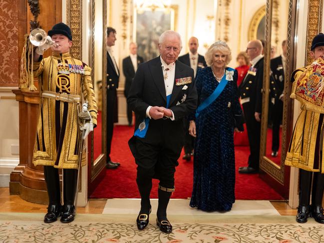 King Charles III, wearing his traditional satin breeches and bespoke shoes created for his coronation, arrives with Queen Camilla for the Diplomatic Corps reception at Buckingham Palace. Picture: Getty Images