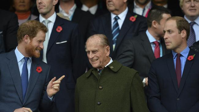 Prince Harry and Prince William, pictured with their grandfather in 2015. Picture: AFP