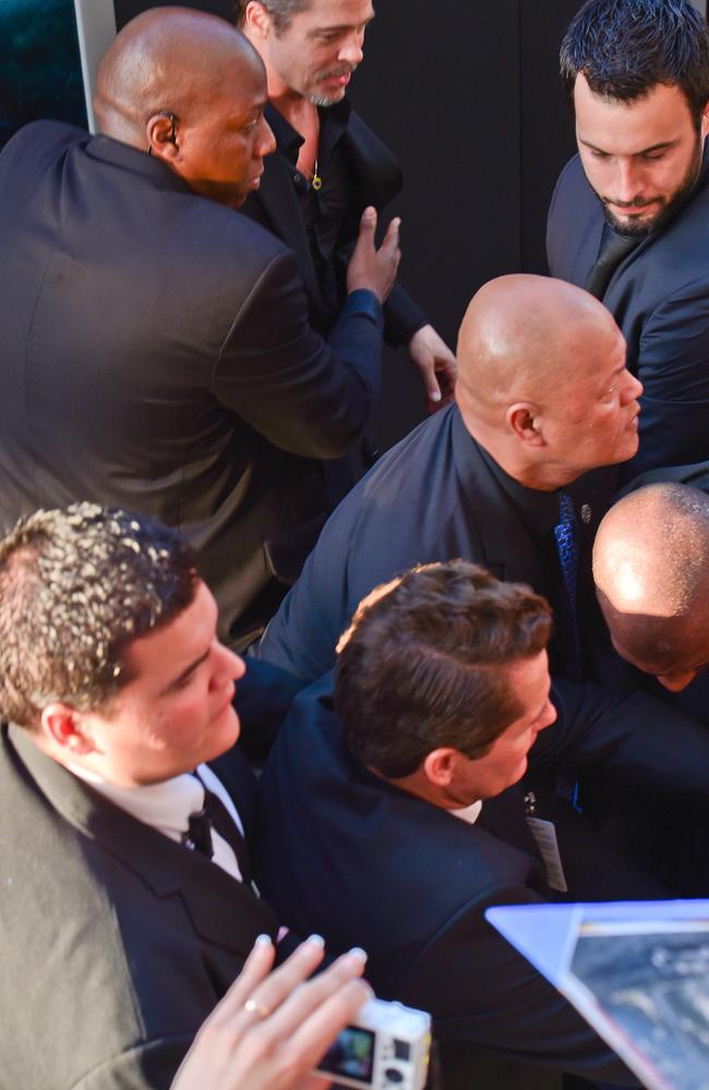 A fan tried to attack Angelina Jolie and Brad Pitt at the Maleficent red carpet event in L.A.