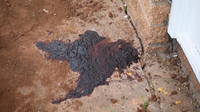 The blood stain on the front porch where a man was stabbed in the chest and arm. Picture: Dean Martin