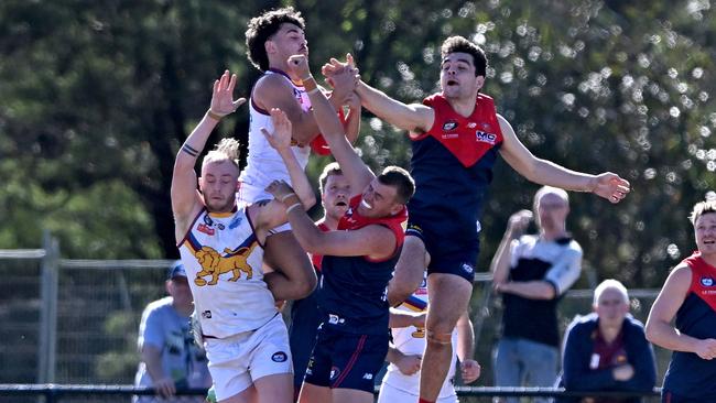 South Morang’s Josh D’Intinosante takes a mark against Diamond Creek last week. Picture: Andy Brownbill