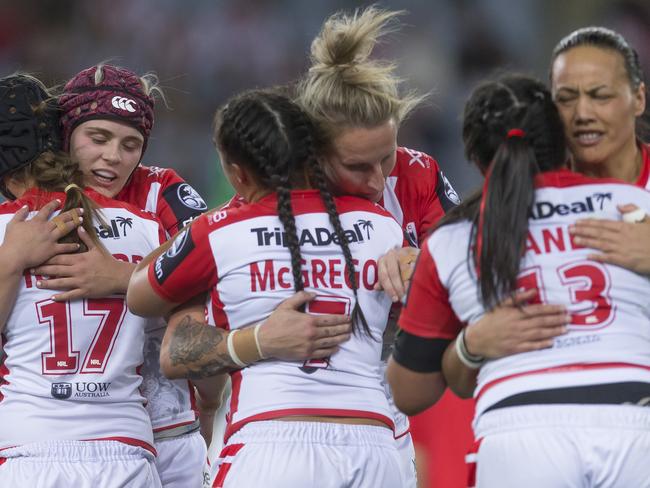 St George Illawarra Dragons players celebrate their win.