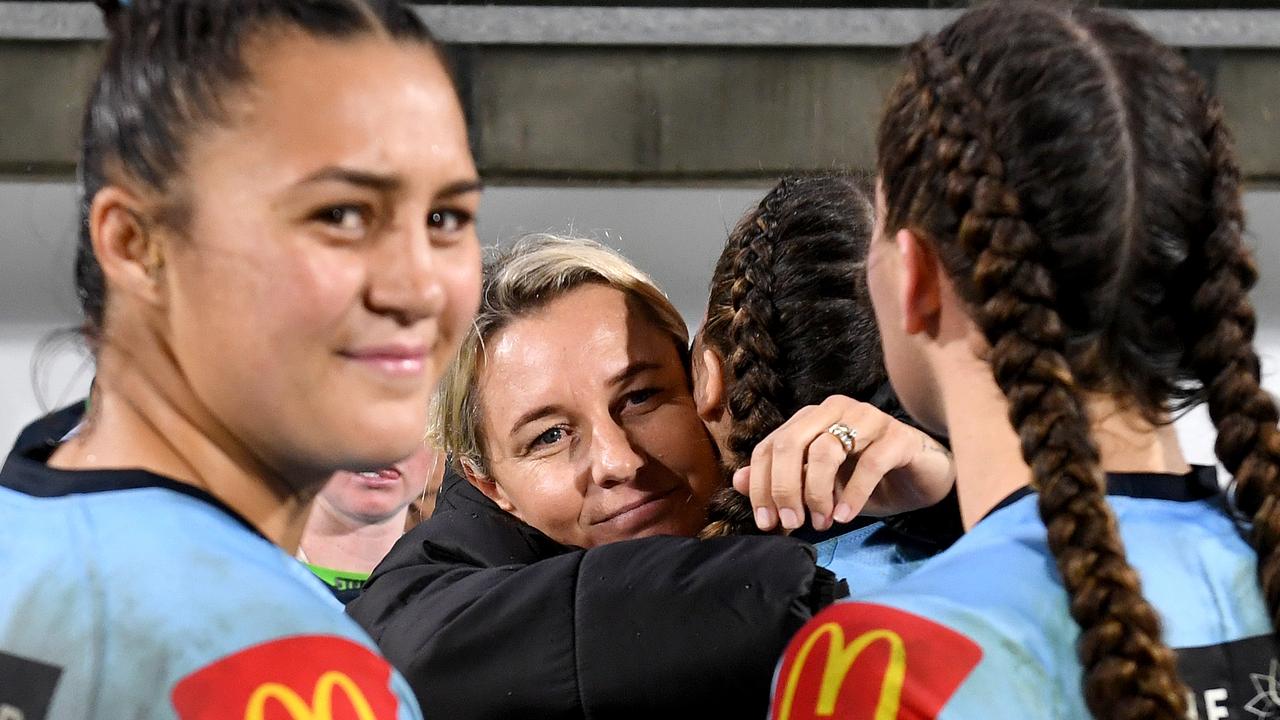 Coach Kylie Hilder consoles her players after NSW comes up short in the State of Origin match at the Sunshine Coast Stadium.