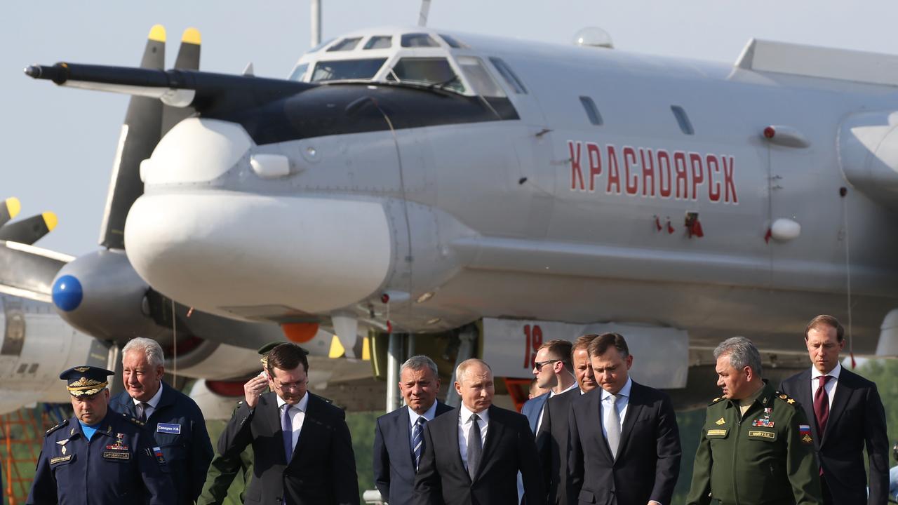 Vladimir Putin in 2019 pictured near the Tupolev TU-95 military plane, which was the same one hit in the Ukraine attack. Picture: Getty Images