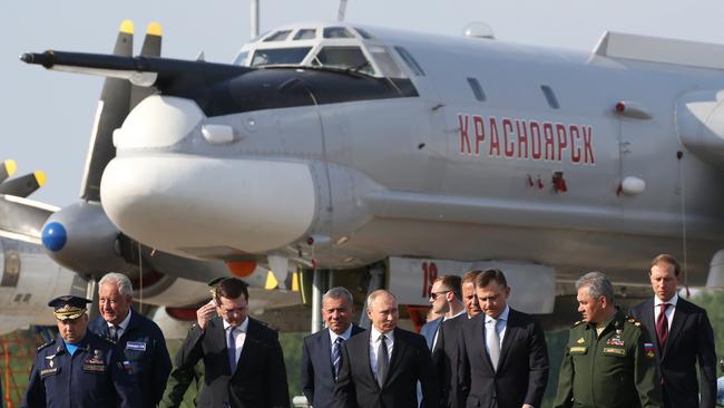 Vladimir Putin in 2019 pictured near the Tupolev TU-95 military plane, which was the same one hit in the Ukraine attack. Picture: Getty Images
