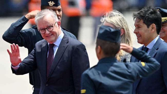 Prime Minister Anthony Albanese waves upon arrival for the APEC summit in Peru. Picture: AFP