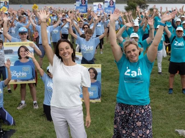 Independent MP for Warringah Zali Steggall (right) and independent candidate for Mackellar Sophie Scamps with their supporters at Dee Why Beach on February 19. Picture: Supplied